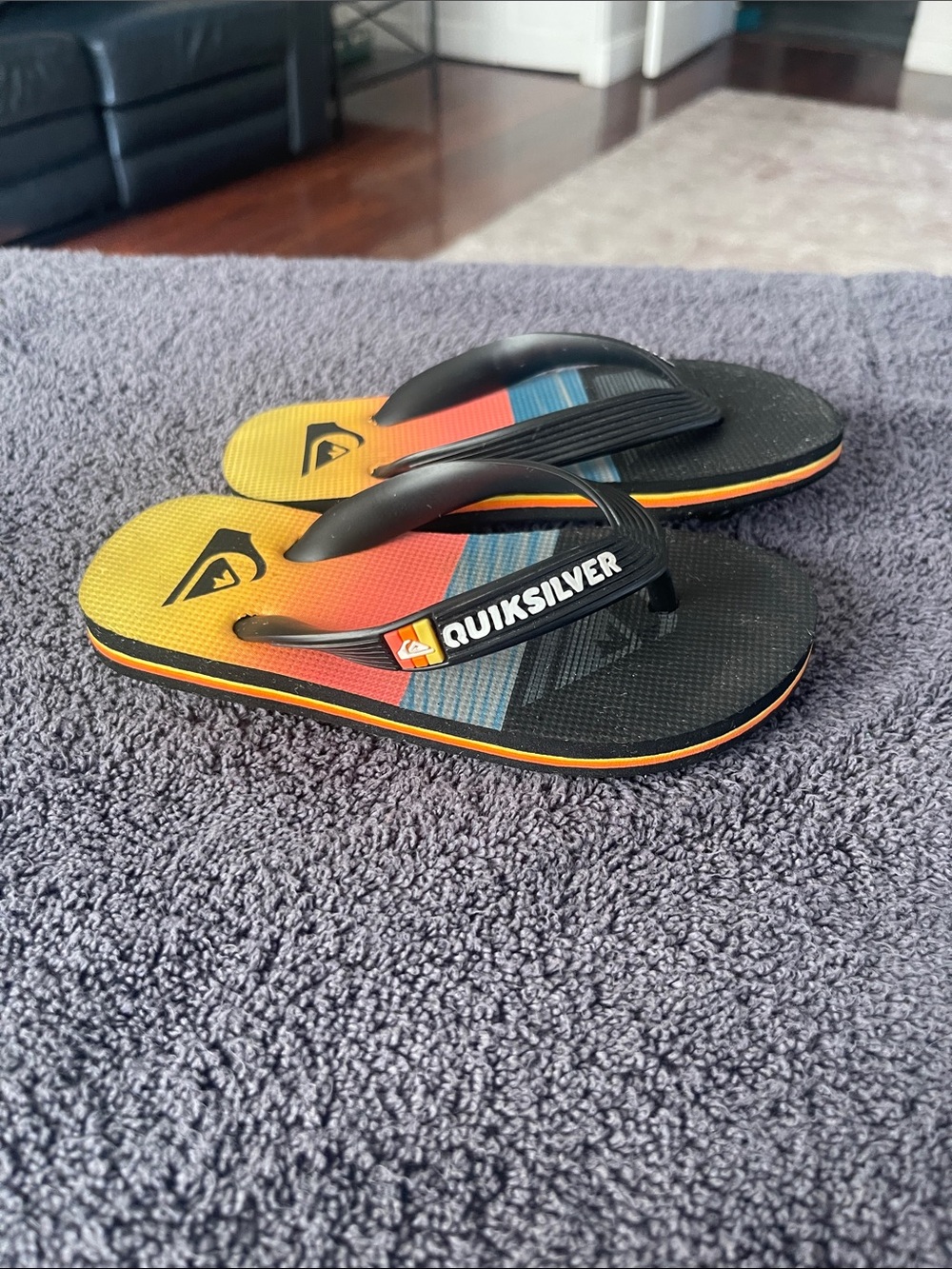 Quiksilver Kids Black Flip Flops with Yellow, Orange and Blue Gradient Footbed